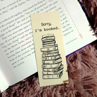 bookmark photographed on top of an opened book