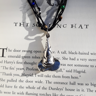 close up photo of the sorting hat charm